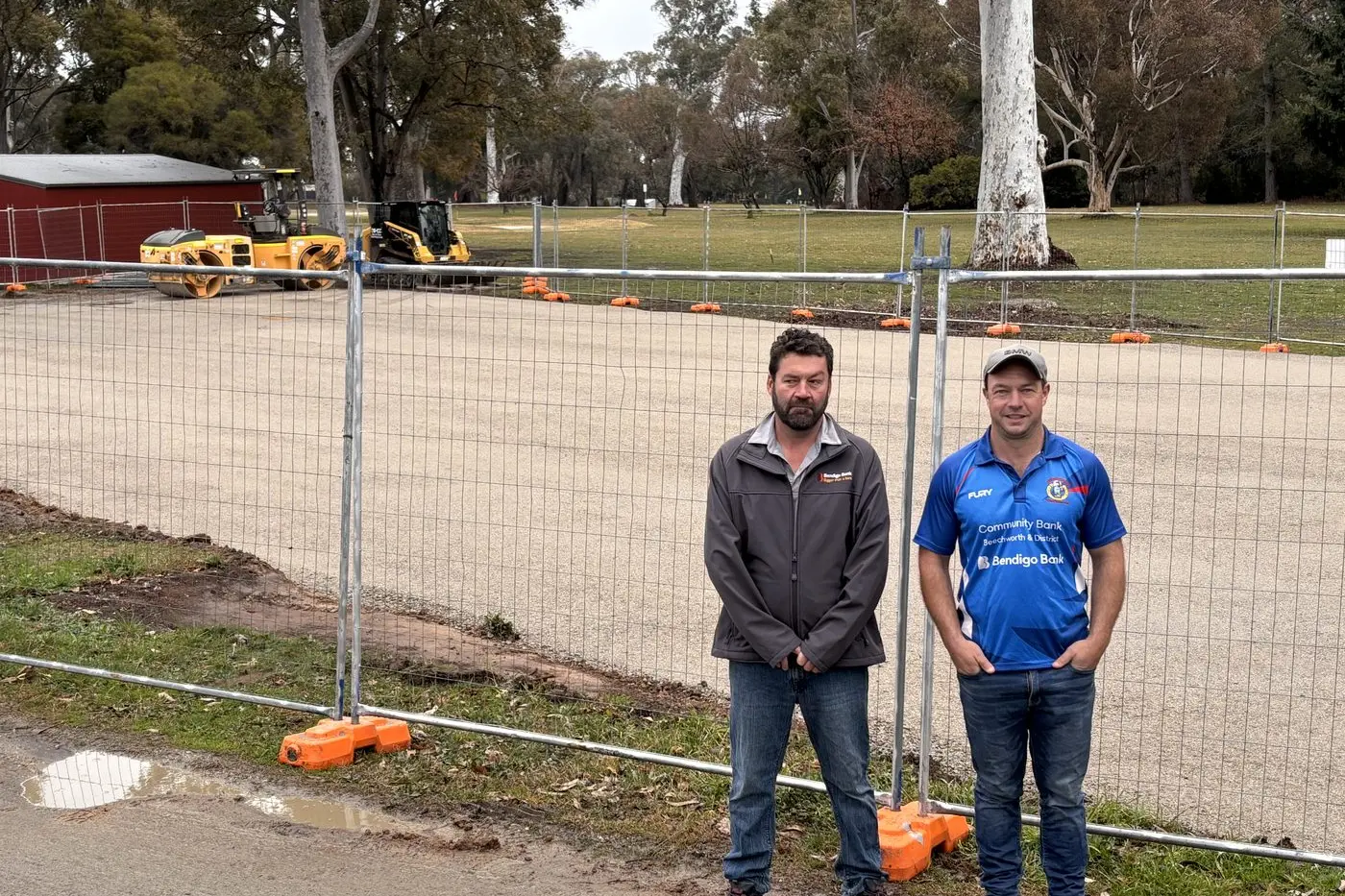 LAYING THE FOUNDATIONS: Ben Merritt, Chair of the Beechworth and District Community Bank  and Brenton Surrey, of the Beechworth Wanderers Cricket Club committee inspecting initial works at the site of the new Baarmutha Park nets.