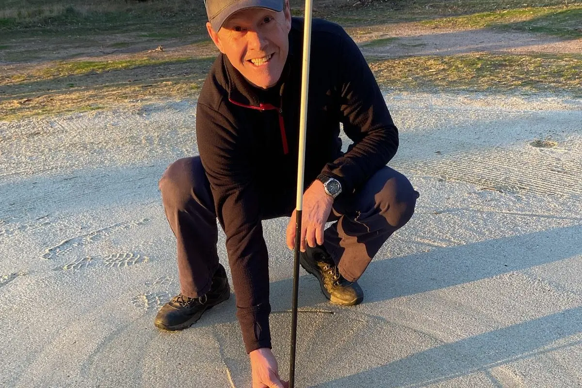 CAT CALL: Graeme \\'Cat\\' Cordy pictured retrieving his ball from the 6th hole on Beechworth Golf Club\\'s par 3 course after sinking a hole in one.