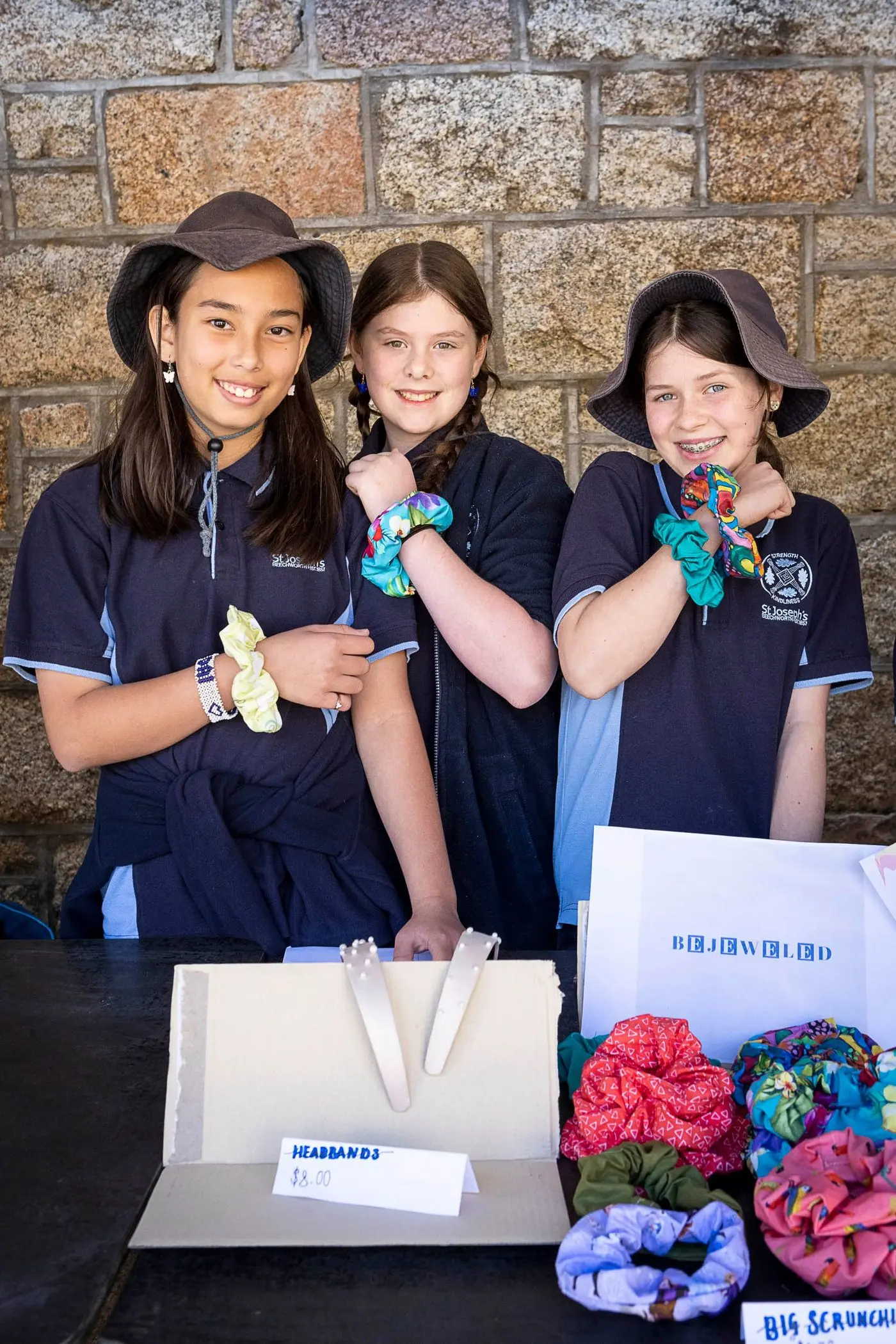 YOUNG ENTREPRENEURS: Kisha Rollins (left), Aleaha Cuncio and Never Taylor showcased their social enterprise skills at last week\\u2019s market held at the Old Beechworth gaol. PHOTO: Erin Davis Hartwig. 