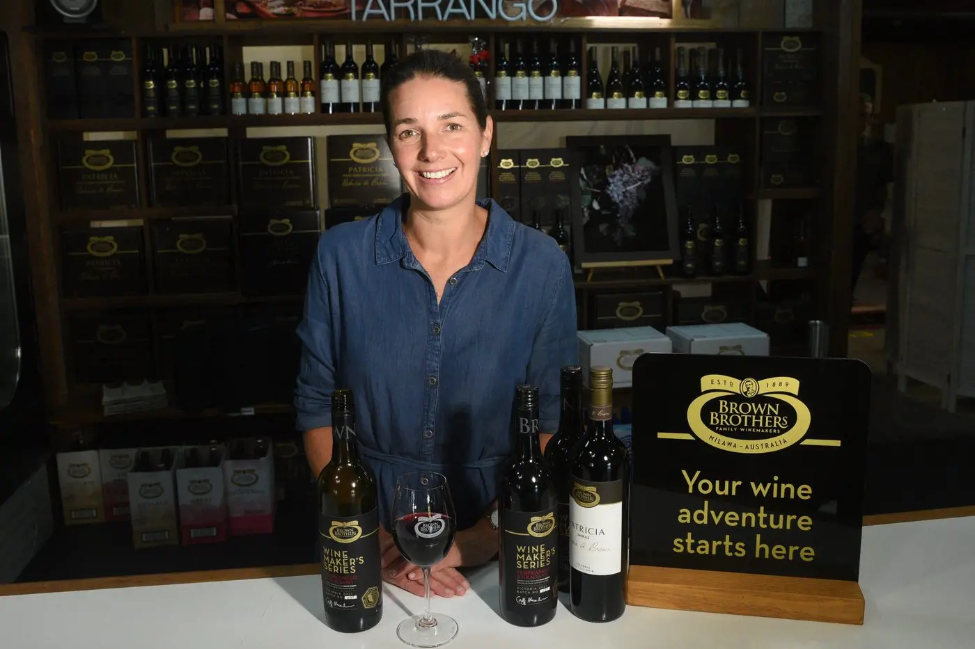 GROWTH STRATEGY: Katherine Brown at the Milawa Winery cellar door with some of Brown Brothers\\' popular wines. PHOTO: Kurt Hickling