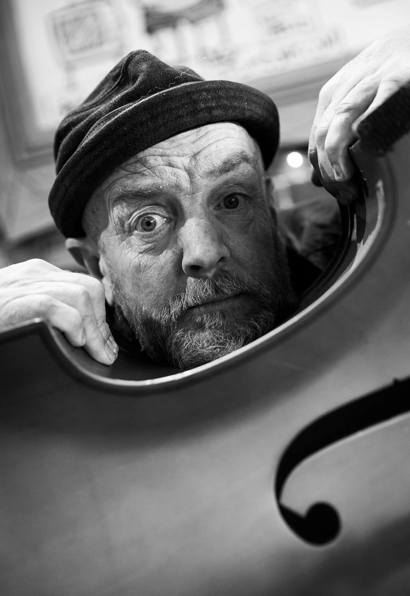 IN TUNE: A portrait of Beechworth cartoonist and musician Adrian Osborne with his double bass, is among the captivating images featured in the Beechworth Family Album - Portraits of Creative Beechworth exhibition. PHOTO: Marc Bongers