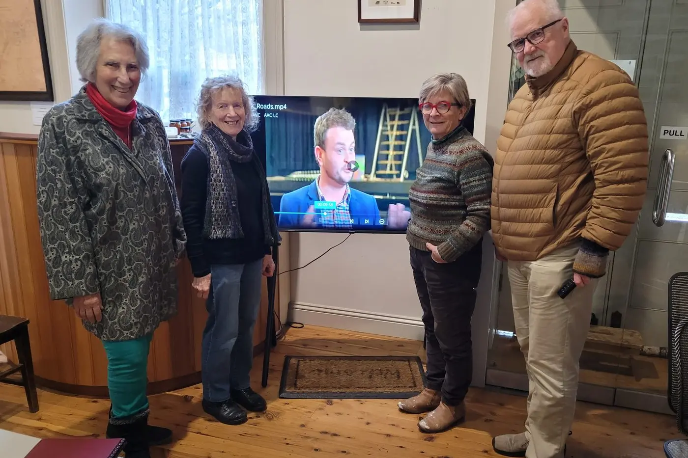 SUPPORTERS: Yackandandah and District Historical Society members helping with the exhibition Thelma Buchanan (left), Helen MacCalman, Yackandandah Theatre Company artistic director Margie Gleeson and Historical Society member Trevor Matthews check out interview footage with Brendan Hogan for the showcase. PHOTO: Coral Cooksley