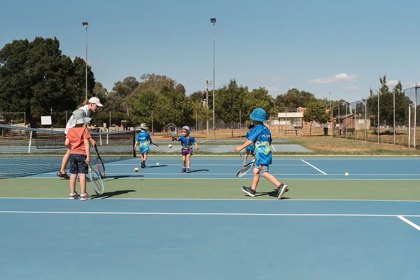 GOOD FUN: Kids get active learning to play tennis in Chiltern. PHOTO: Georgie James Photography