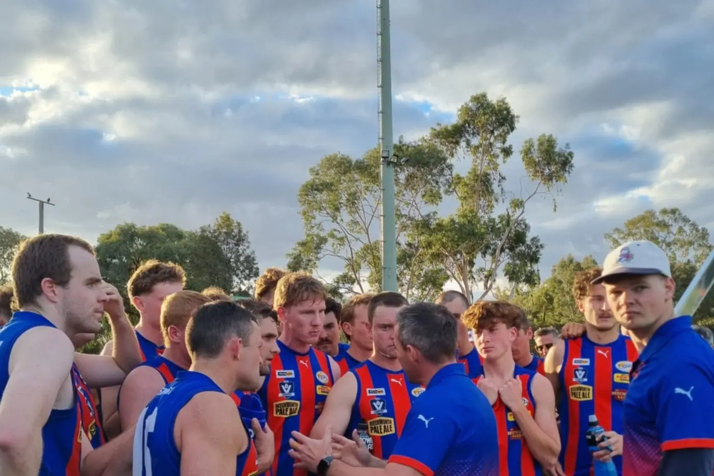BACK TO THE DRAWING BOARD: Beechworth coach Jack Neil addresses his team as the Bushrangers look to bounce back against Rutherglen on Saturday.