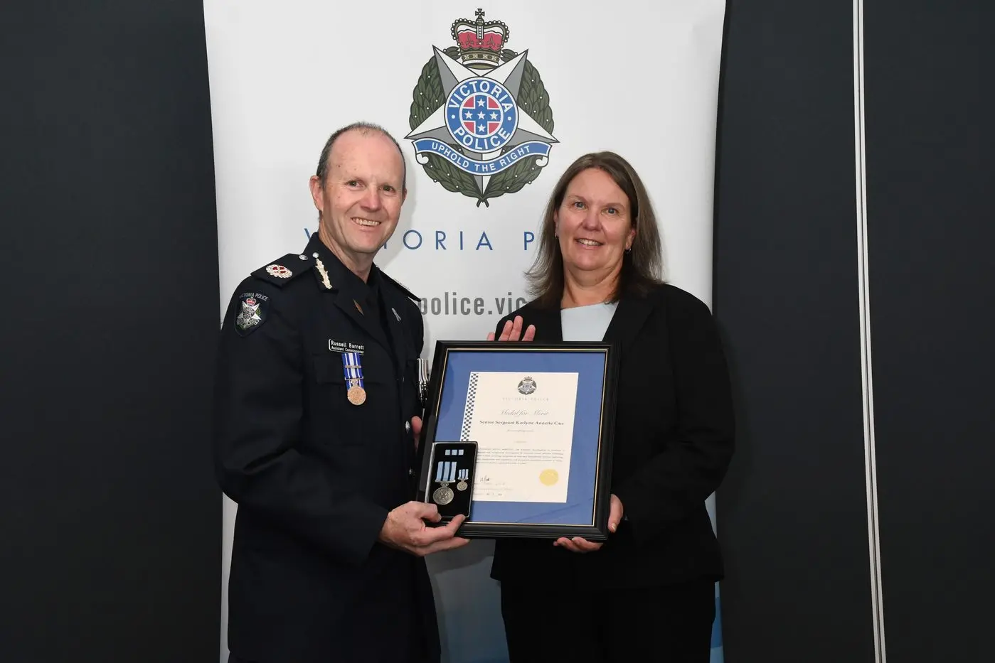OUTSTANDING RECOGNITION: Eastern Region Assistant Commissioner Russell Barrett (left) awards Detective Detective Senior Sergeant Karlyne Carr with the Medal for Merit at the Wangaratta region police awards last Tuesday. PHOTOS: Victoria Police