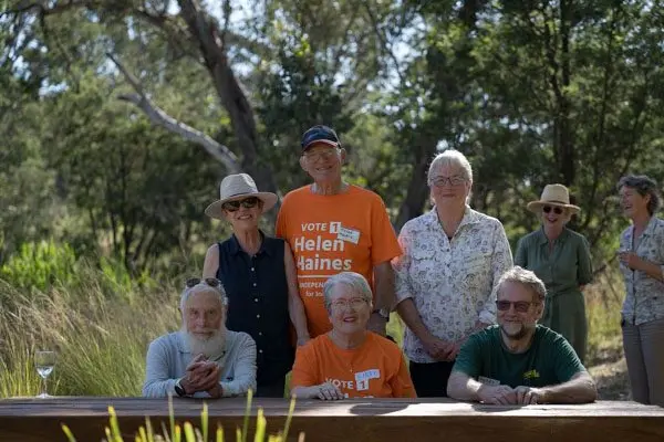 CELEBRATED: Wooragee Landcare members Maree Missen (back left), Pieter Mourik, and Sue Brunskill with Graeme Missen (seated left), Libby Mourik, Terry Shipway and Independent Member for Indi Helen Haines with Anne Stelling in the background. PHOTO: A McCaig Photography