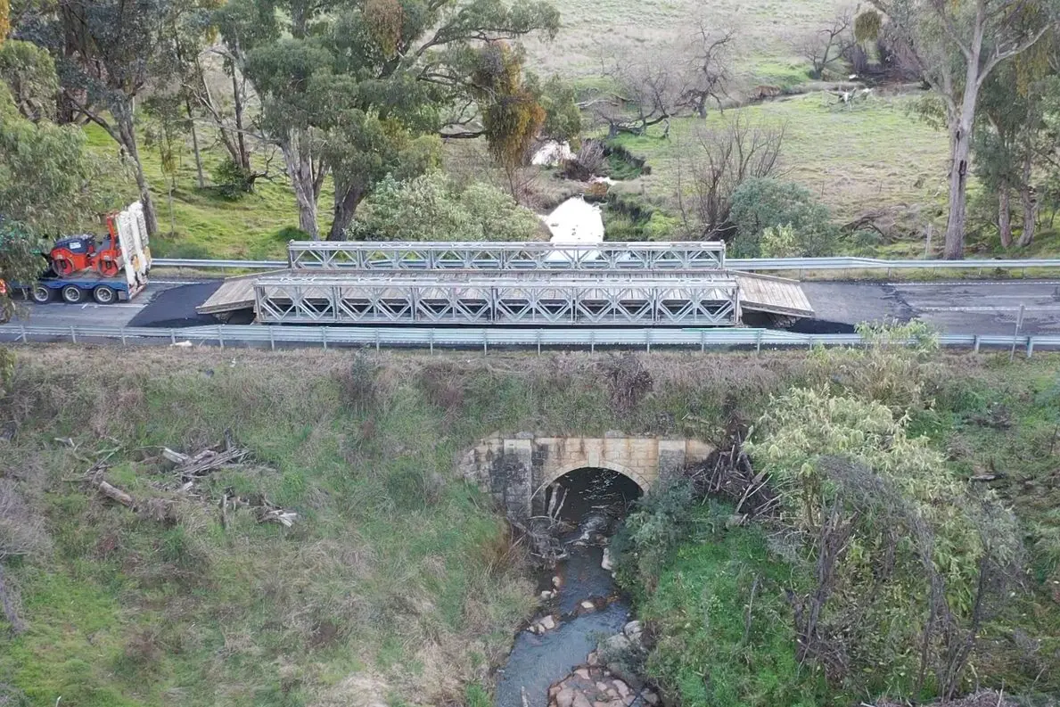 WORKS YET TO BEGIN: A Bailey Bridge across Rising Sun Creek at Beechworth-Wodonga Road will remain in place until repairs to two damaged culverts along the roadway are completed.