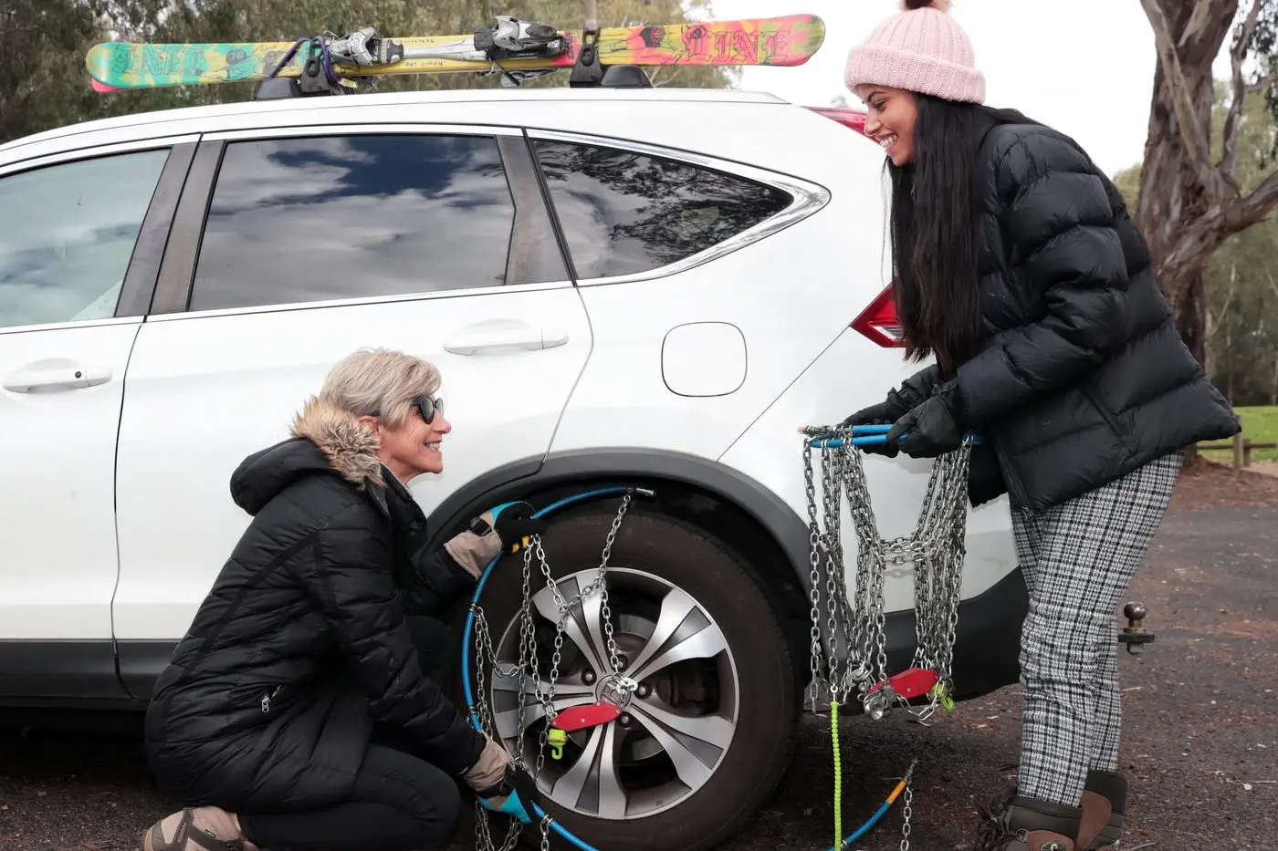 STAY SAFE: RoadSafe North East\\'s Michelle Armstrong and local motorist Santhusha Karunaratna check their vehicle is suitably prepared for driving in the snow. PHOTO: Kieren Tilly Id:25311