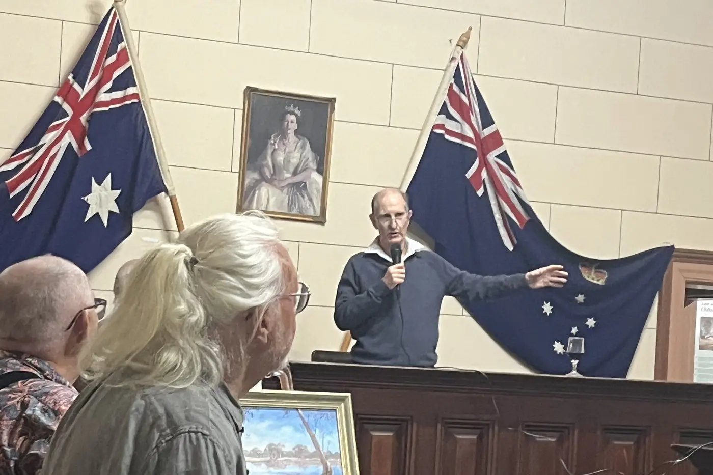ENJOYED: Jeff Reid (left) and George Van der Ware were among a captivated audience when local artist Quentin Bell opened last weekend\\u2019s art exhibition in Chiltern. PHOTO: Belinda Adams