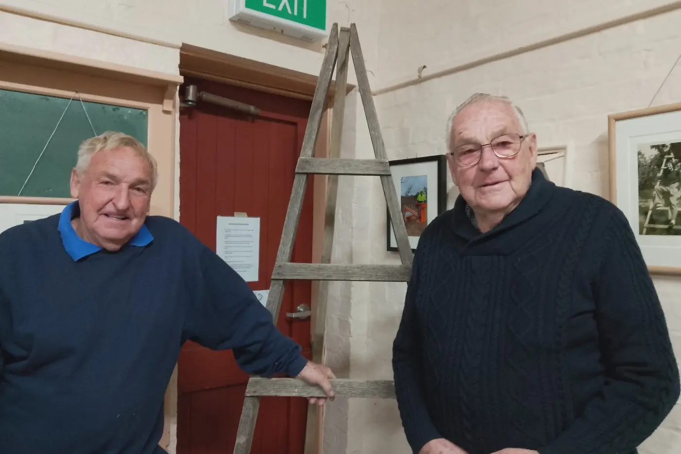 REMINISCED: Peter (left) and Joe Chambeyron with the old wooden picker\\'s ladder made by their brother Tony on show at the exhibition.