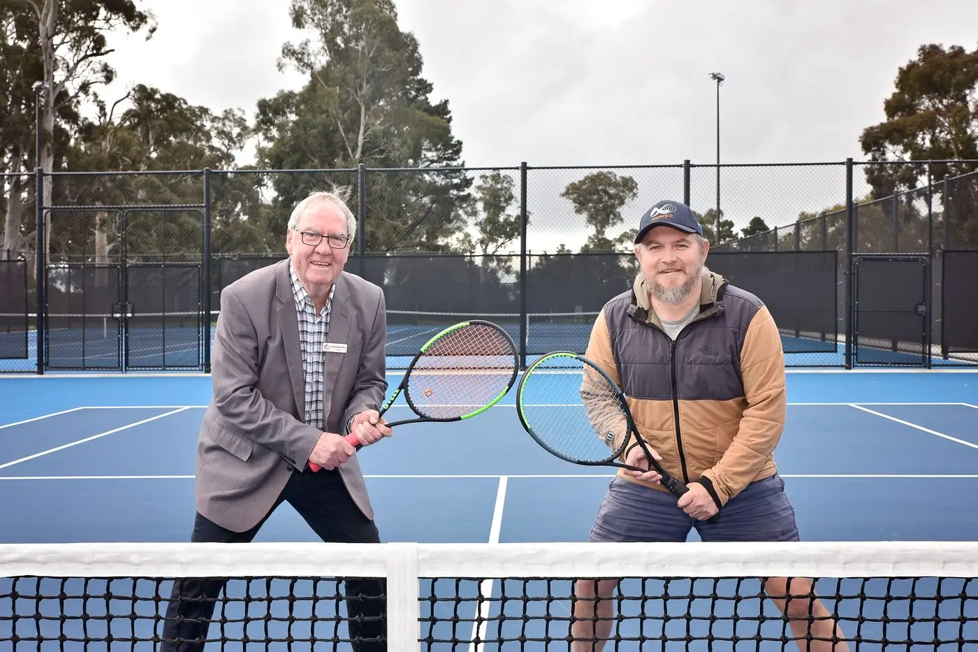 STATE OF THE ART: Indigo Shire Council mayor Bernard Gaffney and Beechworth Lawn Tennis Club vice president Ben Croome showcase the new Baarmutha Park courts, which saw council nominated for a state award. PHOTO: Kurt Hickling Id:31483