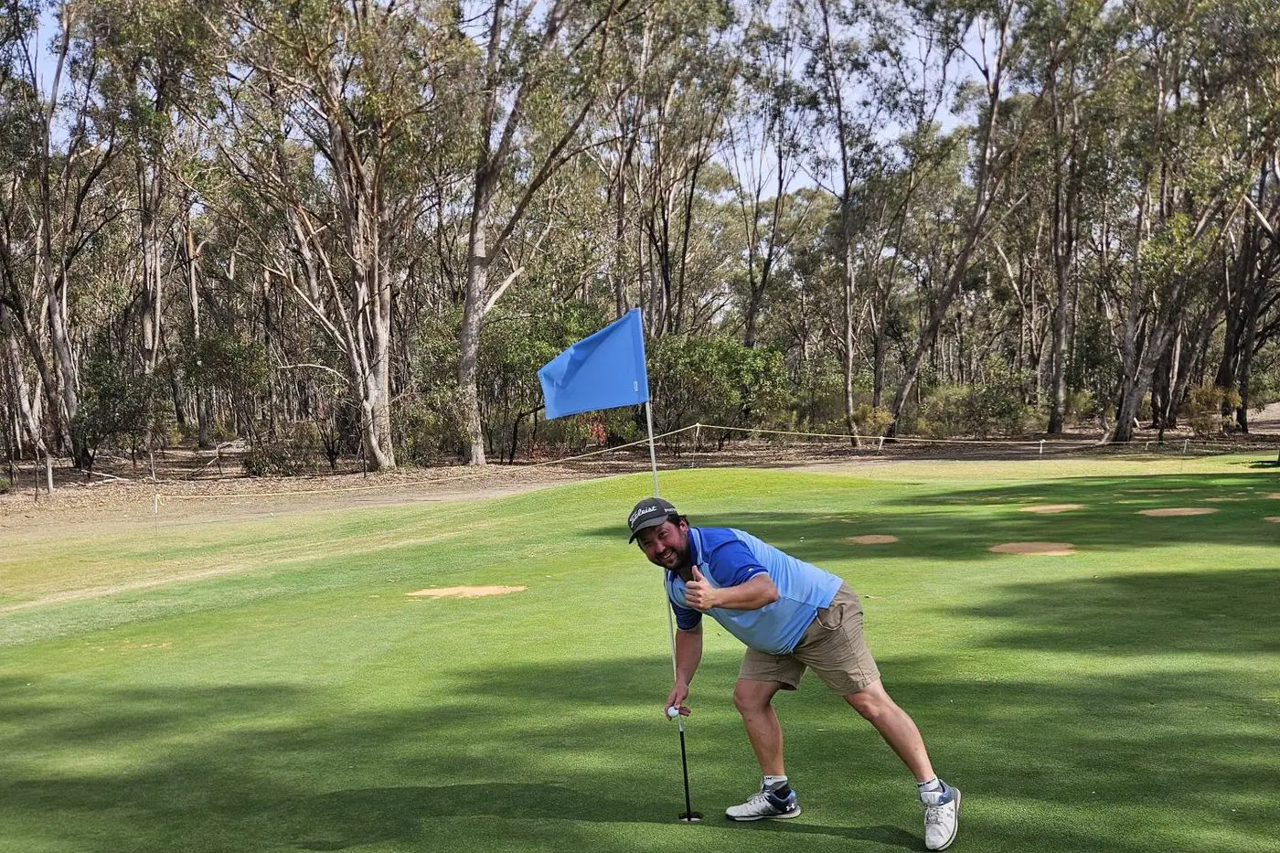 GOLDEN SHOT: Dylan Pool retrieves his ball from the third hole in Benalla on ANZAC Day after hitting his second hole in one this year. 