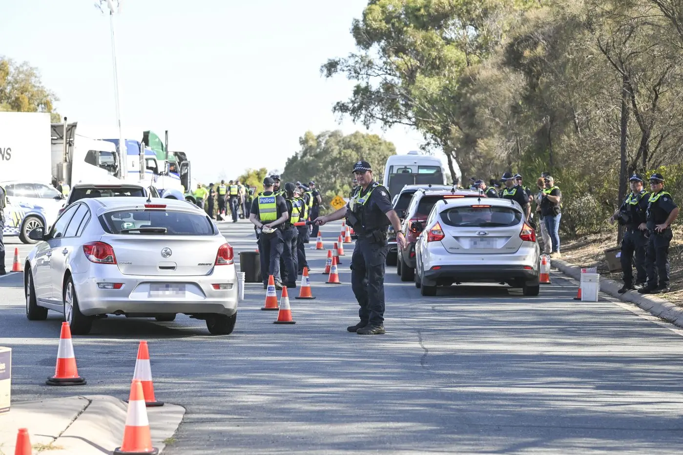 THIS WAY PLEASE: A major police presence was seen at Glenrowan and Springhurst on Friday and Saturday as officers directed virtually every vehicle to designated testing areas. PHOTO: Mark Jesser/Border Mail