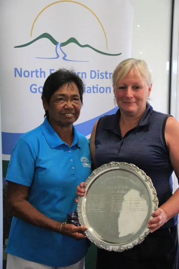 HONOURED WINNER: Glenda Marshall presenting the Beryl Marshall trophy to Beechworth Golf Club\\'s Jan Lang at Yarrawonga last weekend.