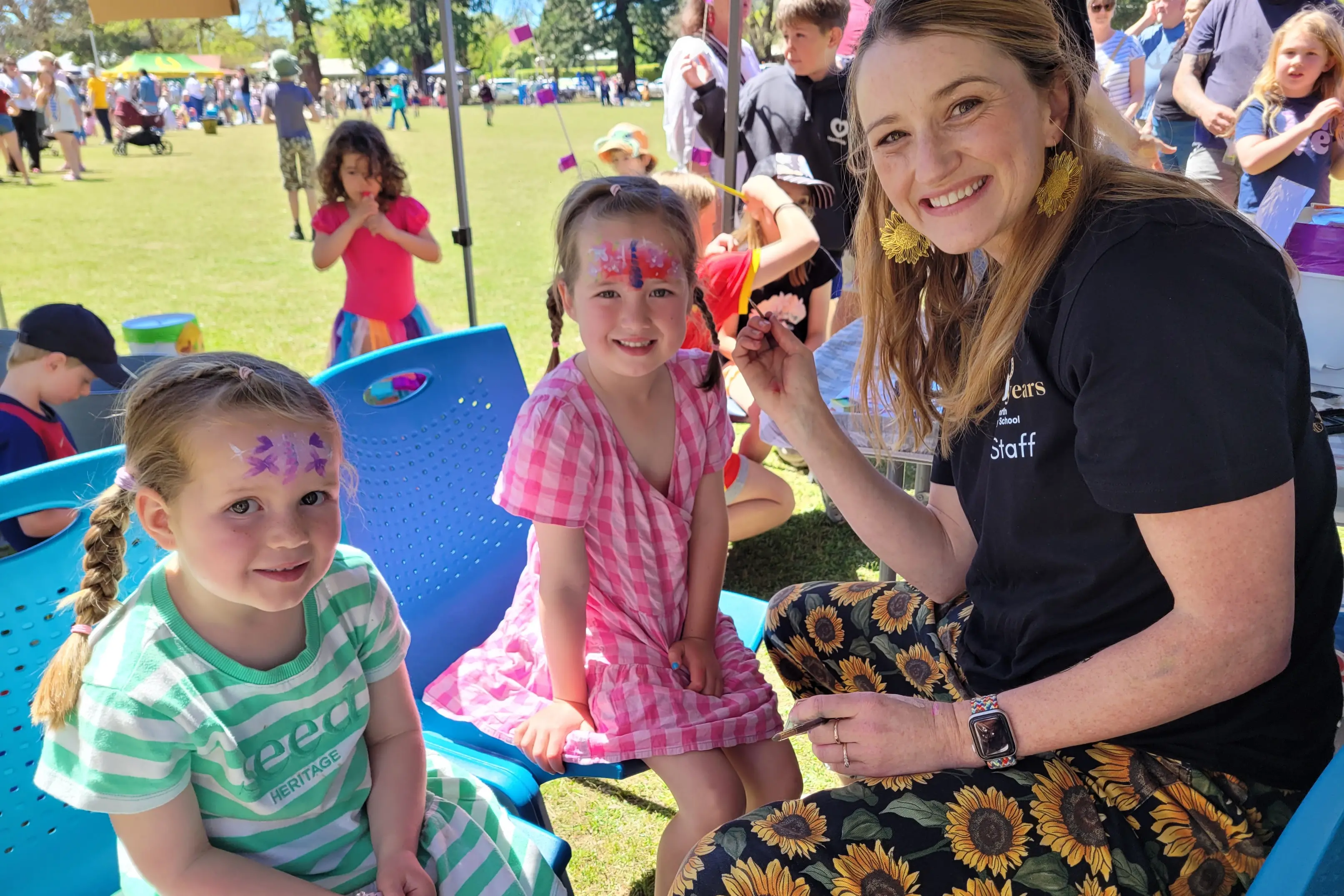 <p>FUN: Four-year-old Eloise Mason (left) and her sister five-year-old Harriet had their faces painted by Beechworth Secondary College teacher Bethany James. PHOTOS: Coral Cooksley</p>\\n