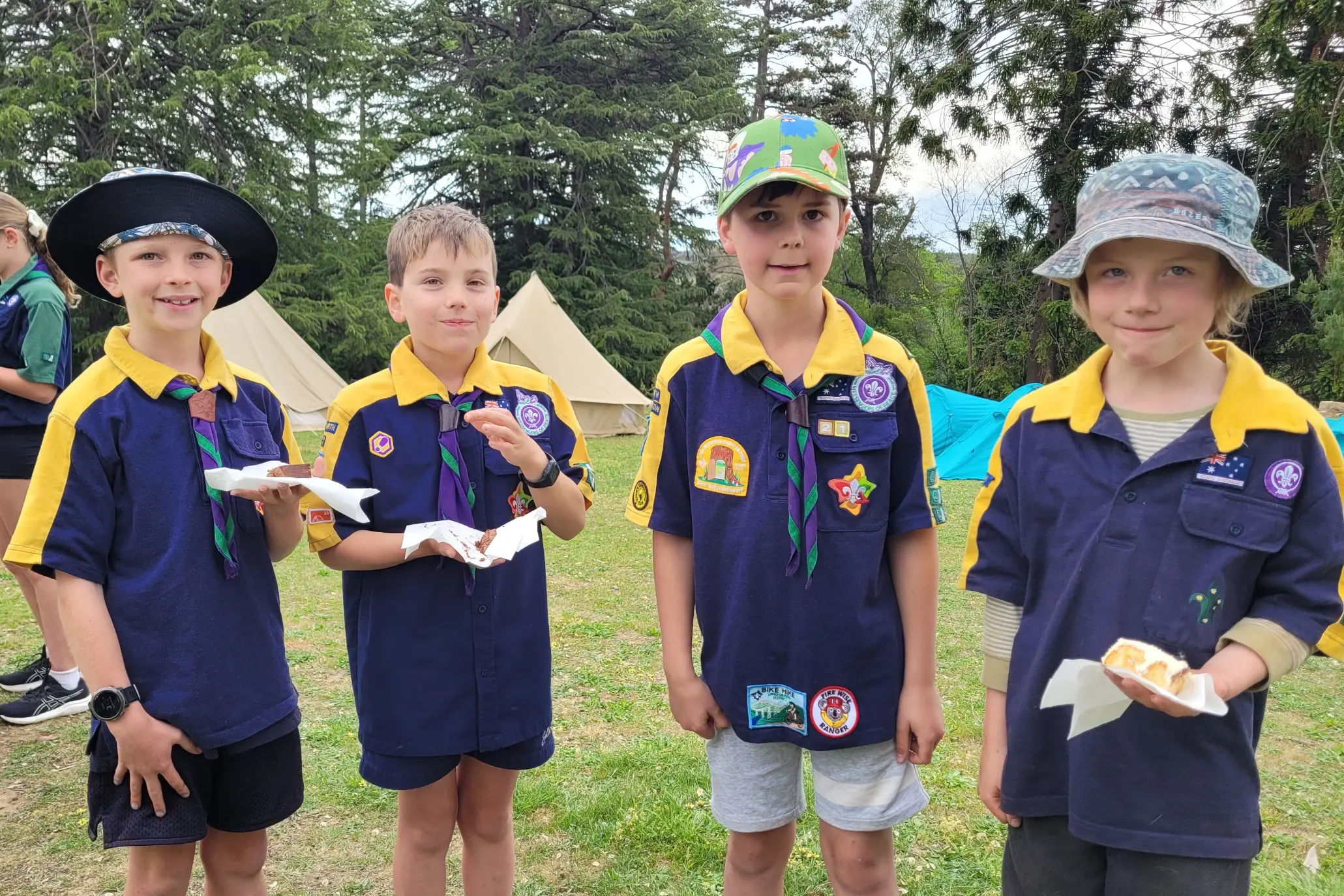 <p>YUM: 1st Beechworth Scout members Archie, Hugh, Joe and Harvest had some birthday cake at the celebration for 100 years of scouting in Beechworth. PHOTO: Coral Cooksley  </p>\\n