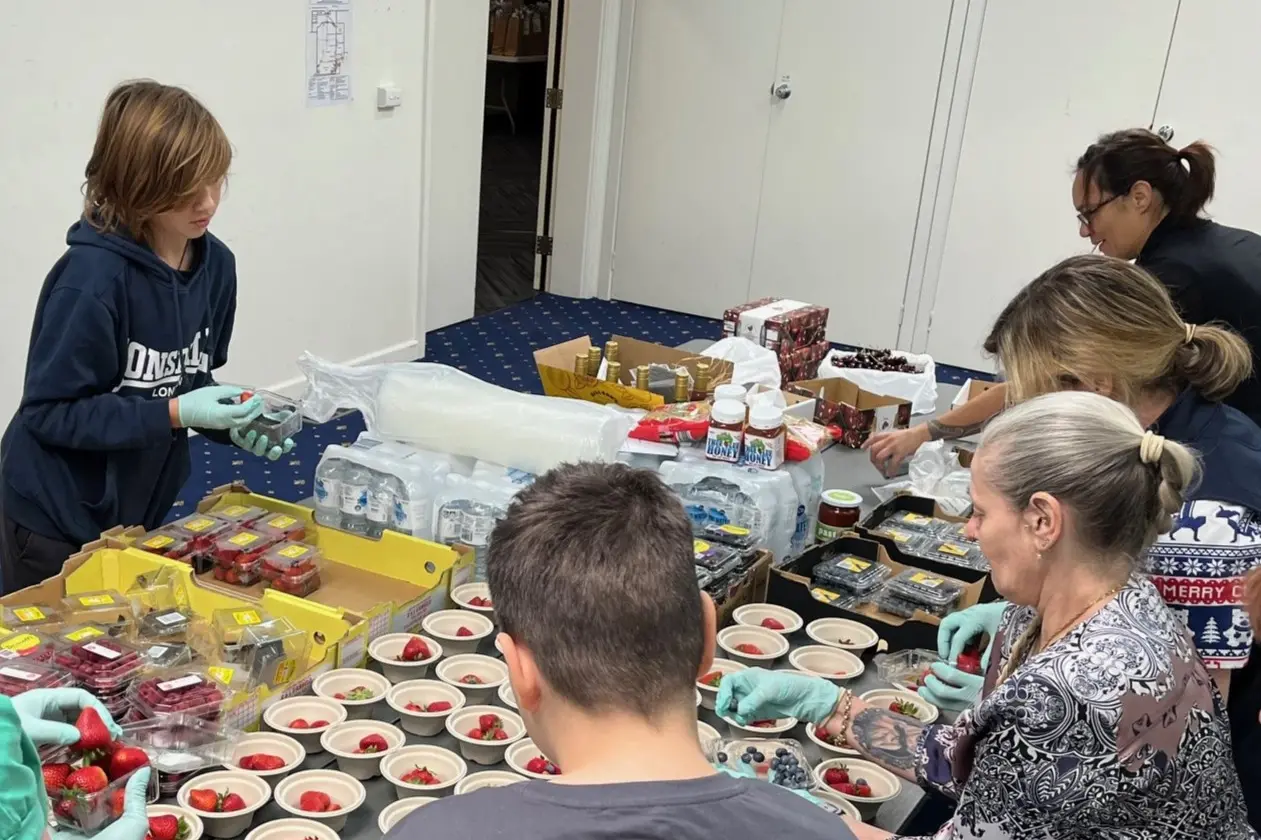 <p>CHRISTMAS SPIRIT: Volunteers from last year\\u2019s Christmas Community Lunch hard at work prepping food for guests. PHOTO: Beechworth Health Service</p>\\n