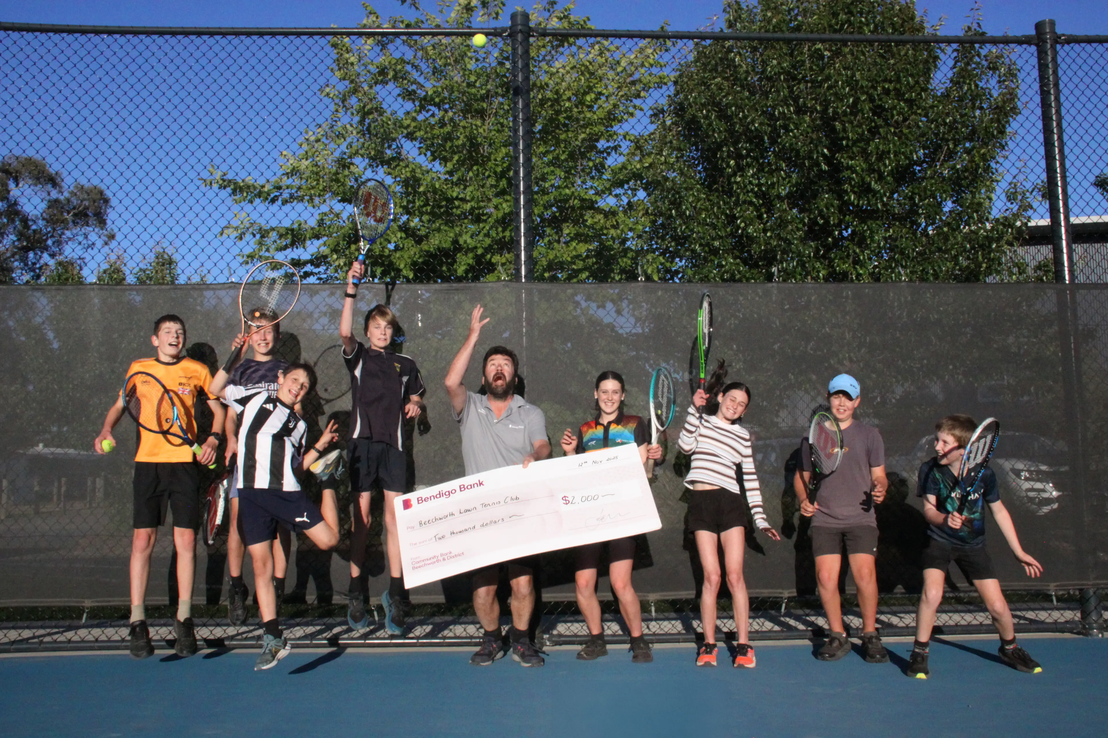 <p>RAISE THE RACQUETS: Beechworth Tennis Club junior members Henry Plowman (left), Kai Maughan, Oscar Cavallin, James Mogg, Olivia Cavallin, Millie Cavallin, Luca Maughan, George Pfahlert and the Community Bank Beechworth & District  chair Ben Merrit celebrate the completion of new seating at the Baarmutha Park tennis courts, thanks to the bank\\'s funding. </p>\\n