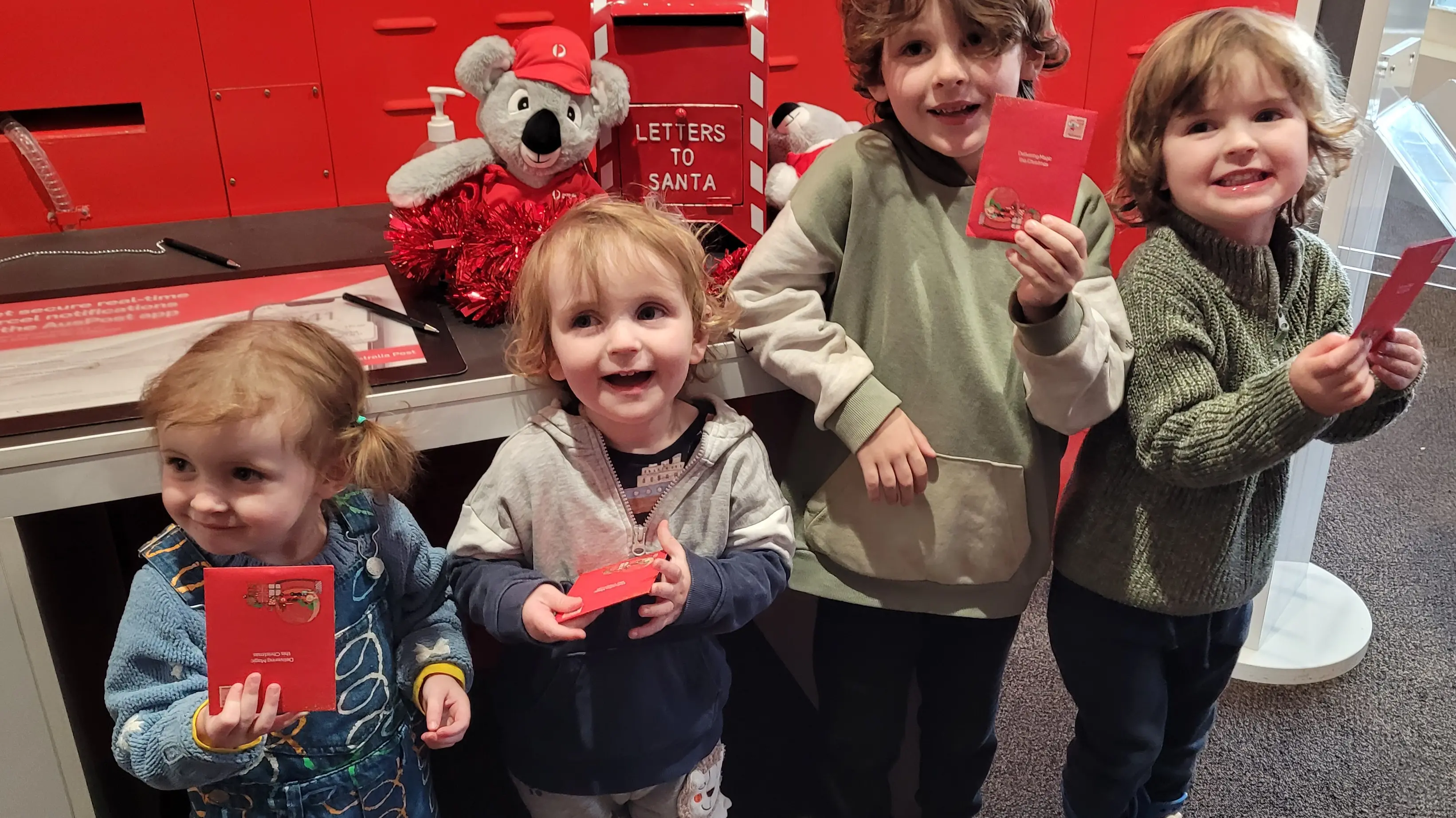 Excited youngsters post letters to Santa