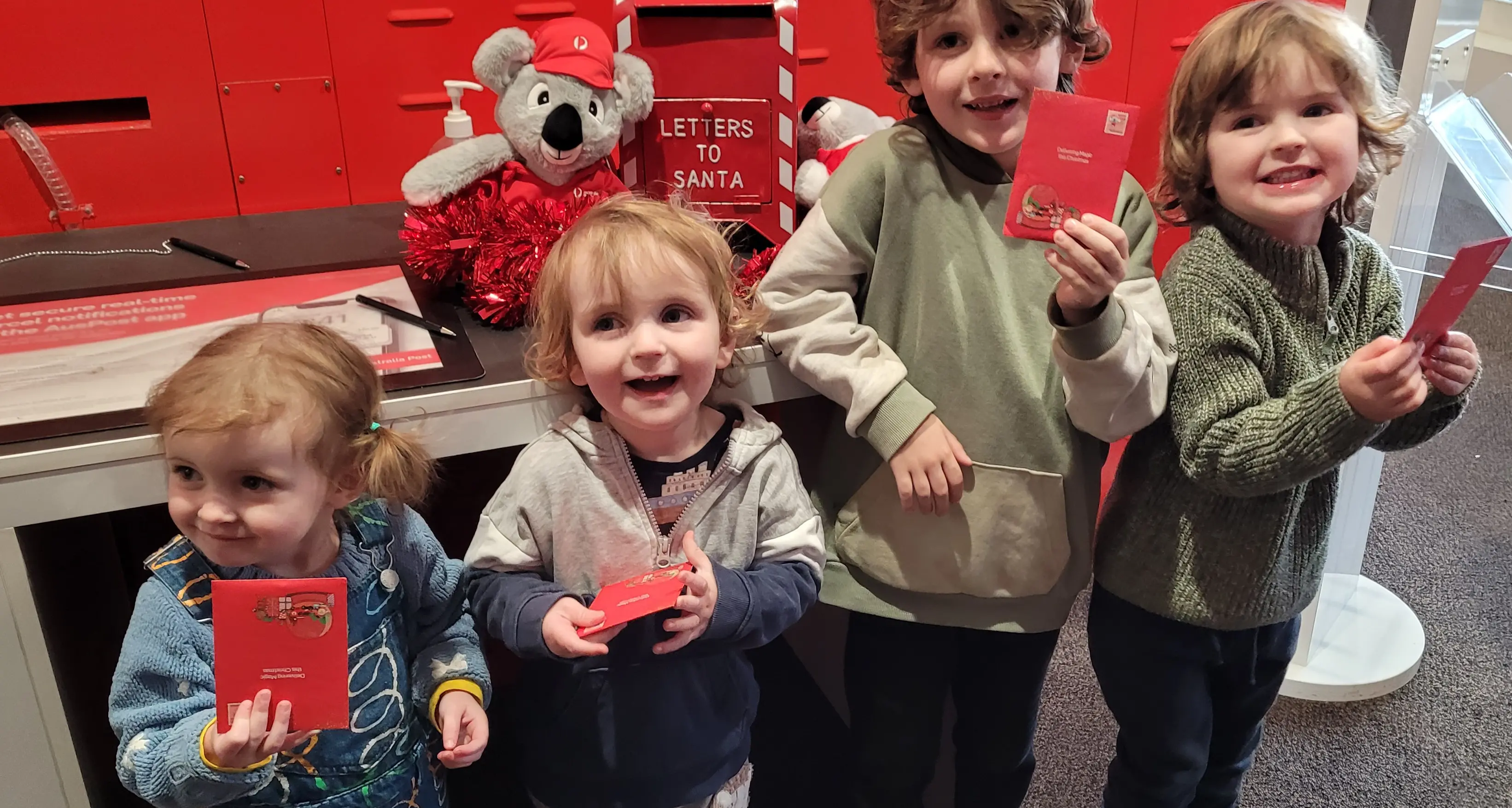Excited youngsters post letters to Santa