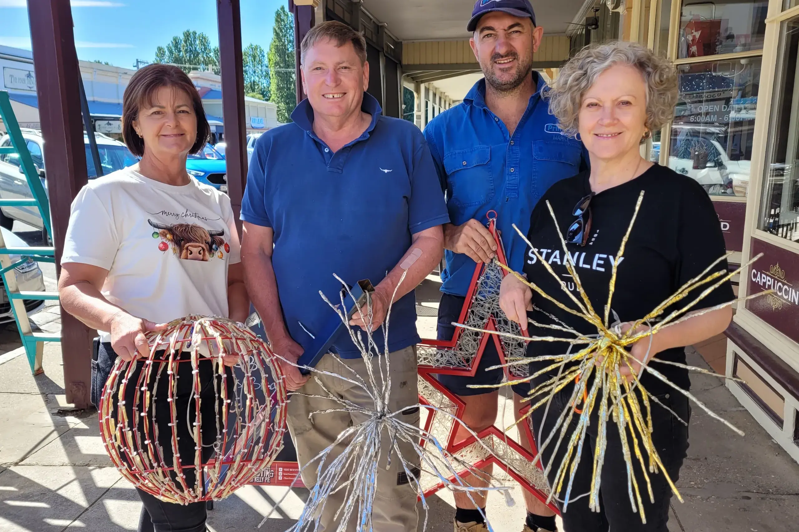 <p>CHRISTMAS CHEERS: Beechworth Inc. members Sue Humphris (left), Ian Longfield, local electrician Mark Primerano and Katrina Witherow were some of the volunteers who on Wednesday helped create Christmas sparkle for Beechworth. PHOTO: Coral Cooksley</p>\\n