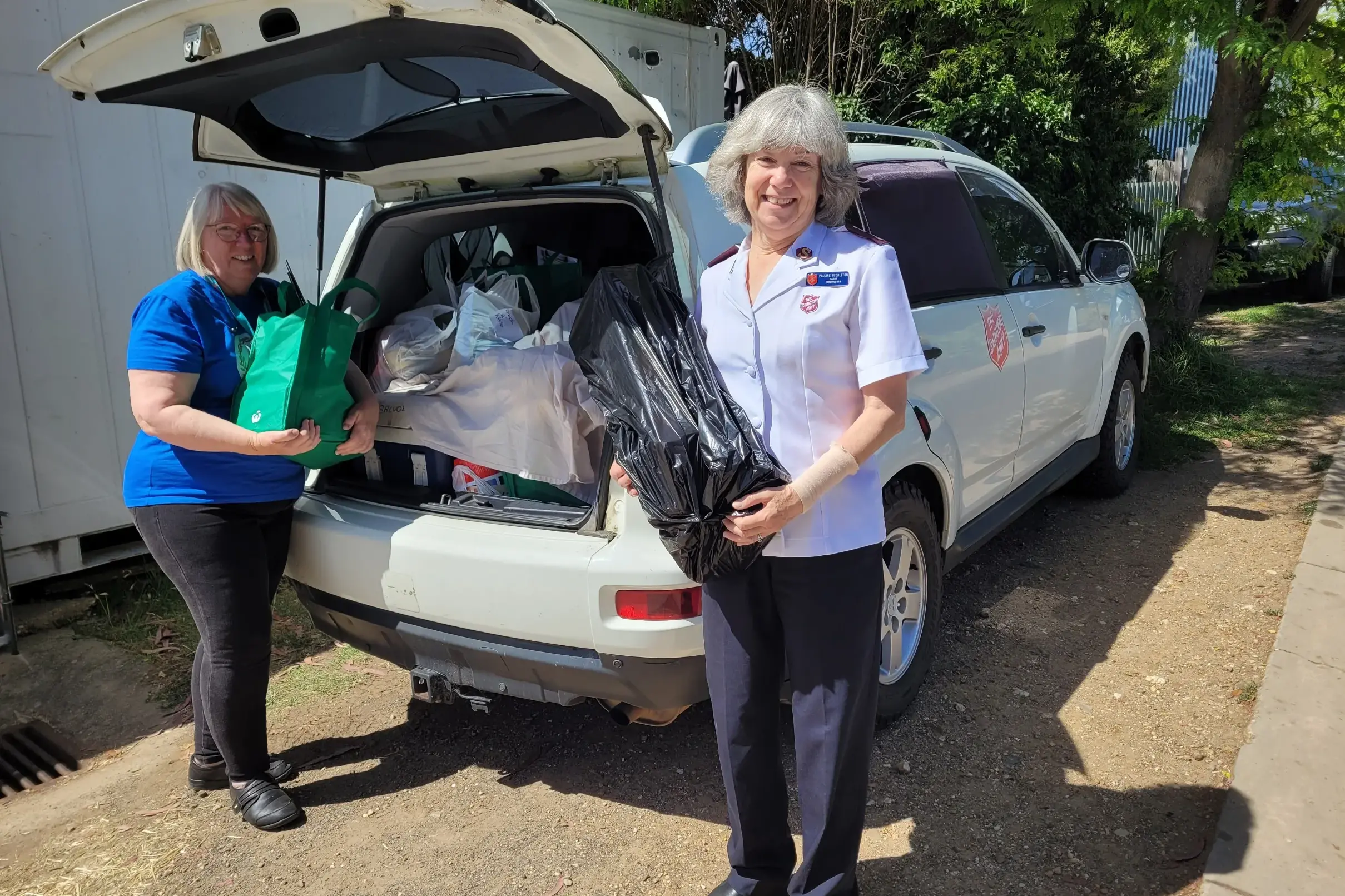 <p>ON THE ROAD: Salvation Army member Linda Erskine (left) with major Pauline Middleton finish packing the car for another run with groceries, toiletries and toys for people in need. PHOTOS: Coral Cooksley</p>\\n