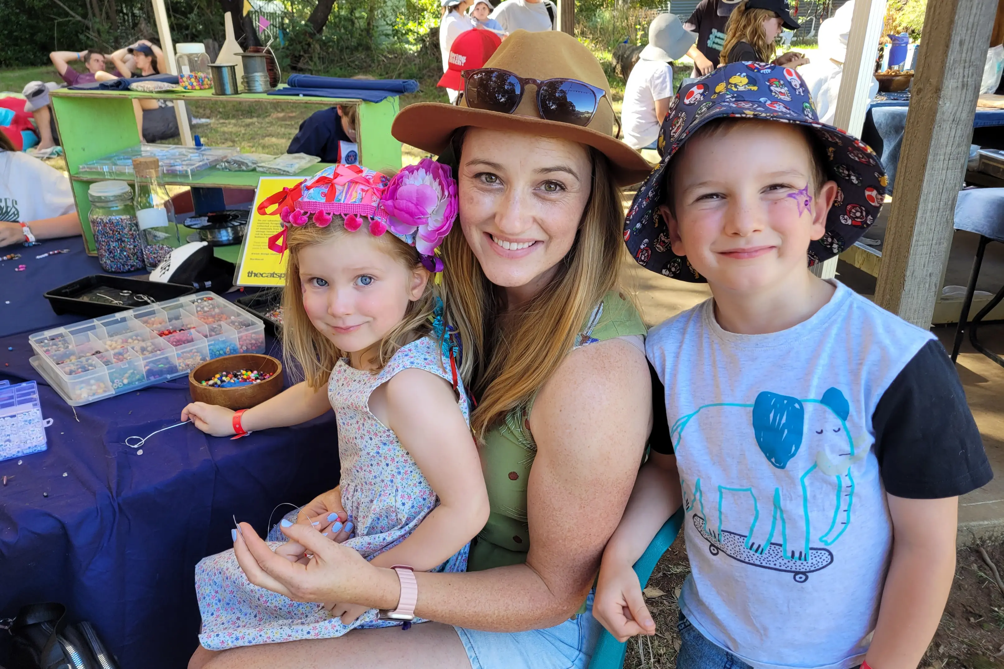 <p>CREATIVE: Beechworth\\u2019s Bethany James with her children James (6) and Daphne (3) Basson at all day \\u2018Cat\\u2019s Pyjamas\\u2019 fun activities, with Daphne making a bracelet. PHOTO: Coral Cooksley</p>\\n