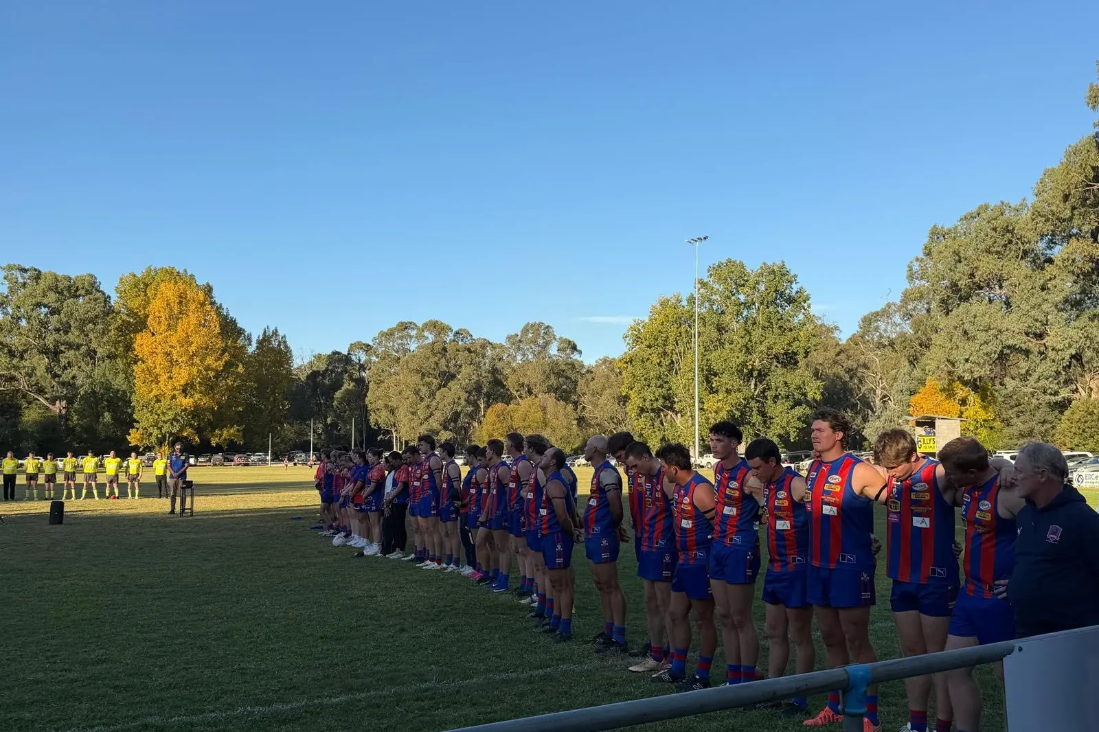 <p>A SALUTE AT DUSK: Beechworth and Yackandandah clubs paused to commemorate ANZAC Day at Butson Park prior to the start of the senior football and netball under lights. PHOTO: BFNC</p>\\n