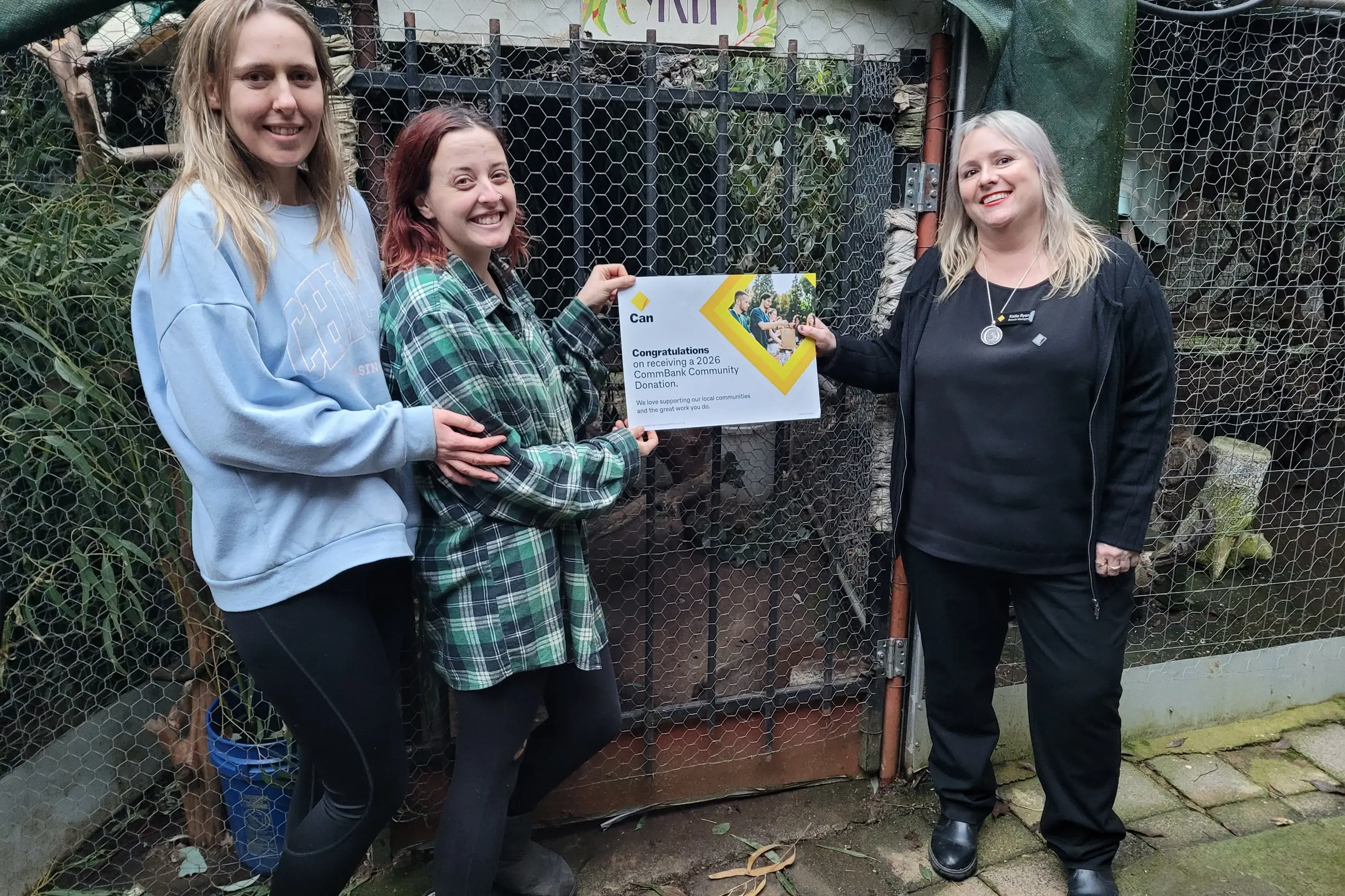 <p>HAPPY: Volunteers from the UK at the Kangaloola Wildlife Shelter Jess Knight (left) and Lorna Dalziel accepted a CBA donation on behalf of Glenda Elliott from Beechworth Bank branch manager Katie Ryan last Friday. PHOTO: Coral Cooksley</p>\\n
