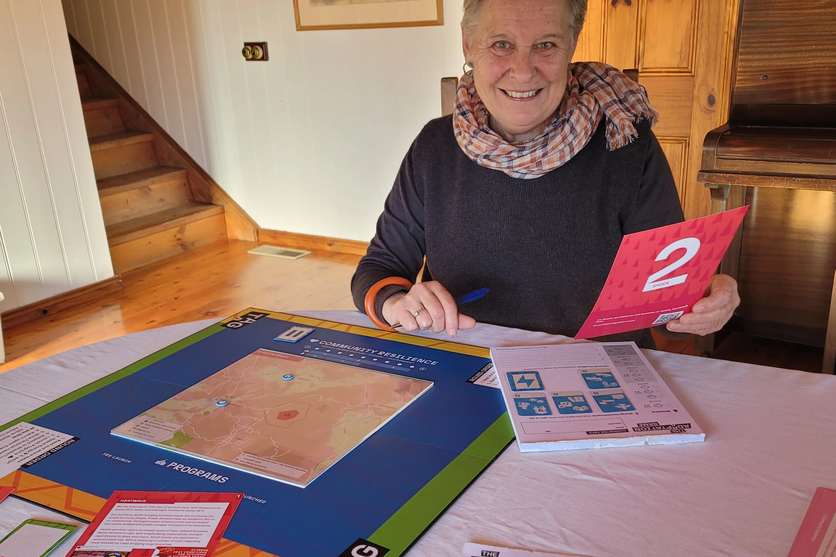 <p>VITAL ACTION: Indigo Regen\\u2019s Lesley Milne with one of the adaptation board games to be launched next week at the Beechworth Town Hall. PHOTO: Coral Cooksley</p>\\n