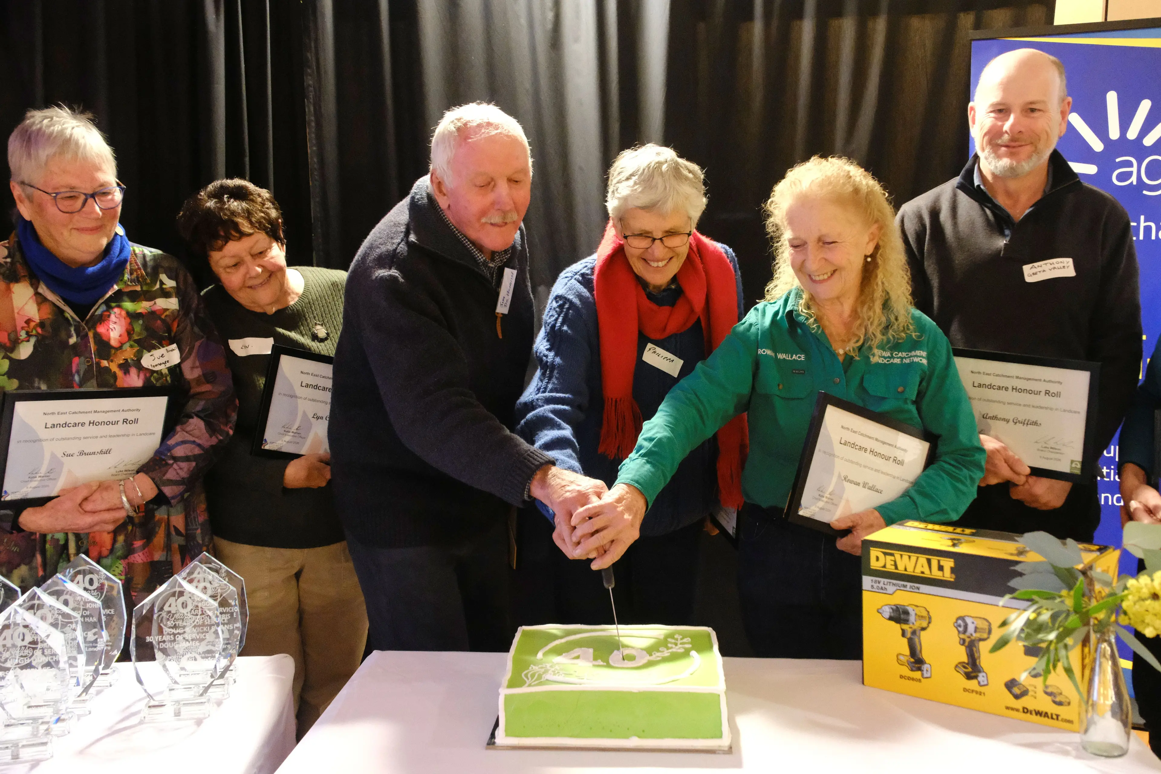 <p>ALL SMILES: Some of the members on the new Honour Roll Sue Brunskill (left), Lyn Coulster, with Jim de Hennin, Phillipa Noble and Rowan Wallace cutting the special anniversary cake and Anthony Griffith on Sunday. PHOTO: Di Thomas</p>\\n