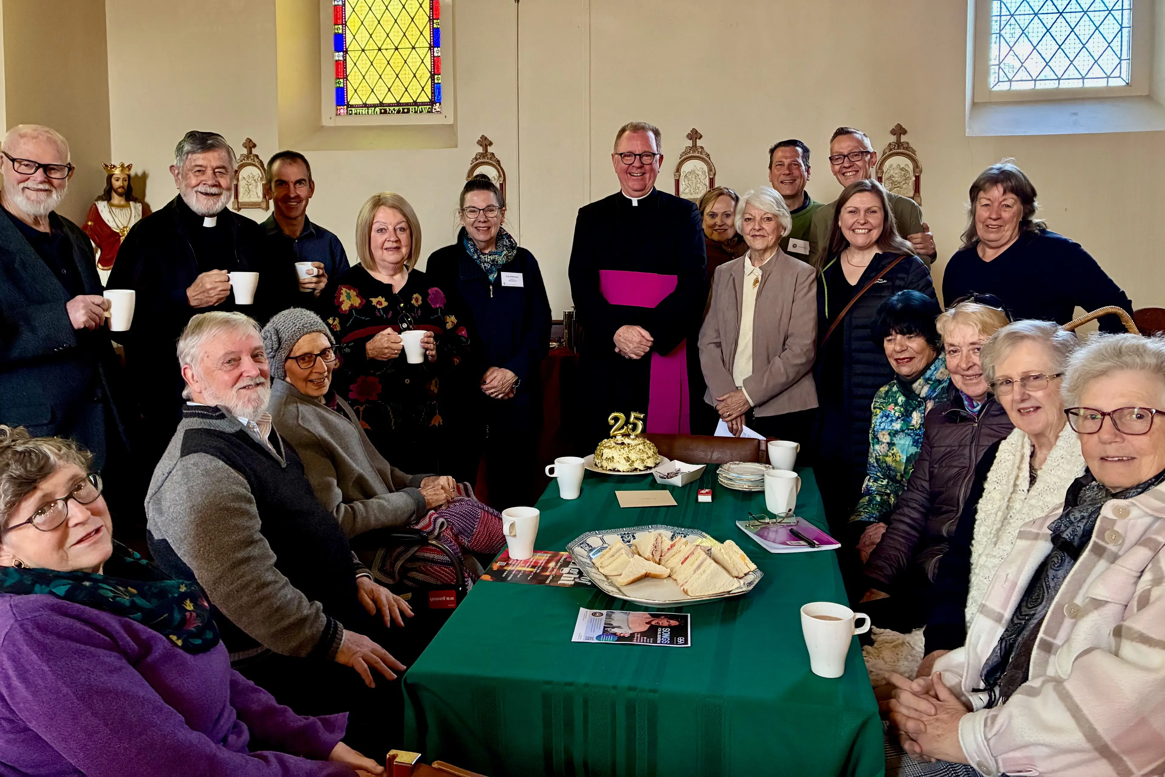 <p>SILVER ANNIVERSARY Fr. Matthew Healy (centre) with Beechworth parishioners at Sunday\\'s morning tea. PHOTO: Jamie Kronborg</p>\\n