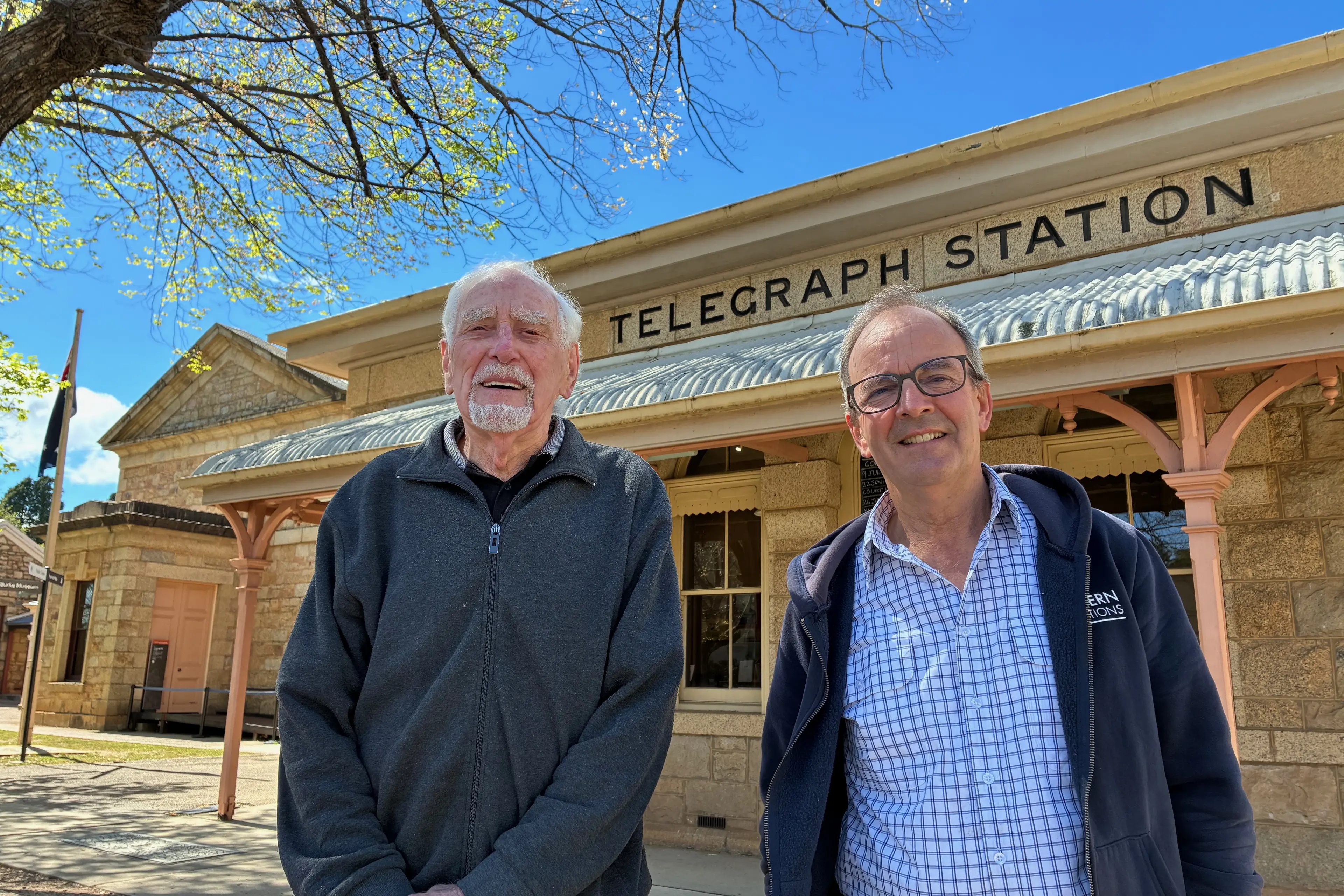 <p>REVEALED: Beechworth Telegraph Station guide and author Leo Nette (left) with former signwriter David Collier in front of the stone inscription on the station parapet that David uncovered in 2001. PHOTO: Jamie Kronborg</p>\\n